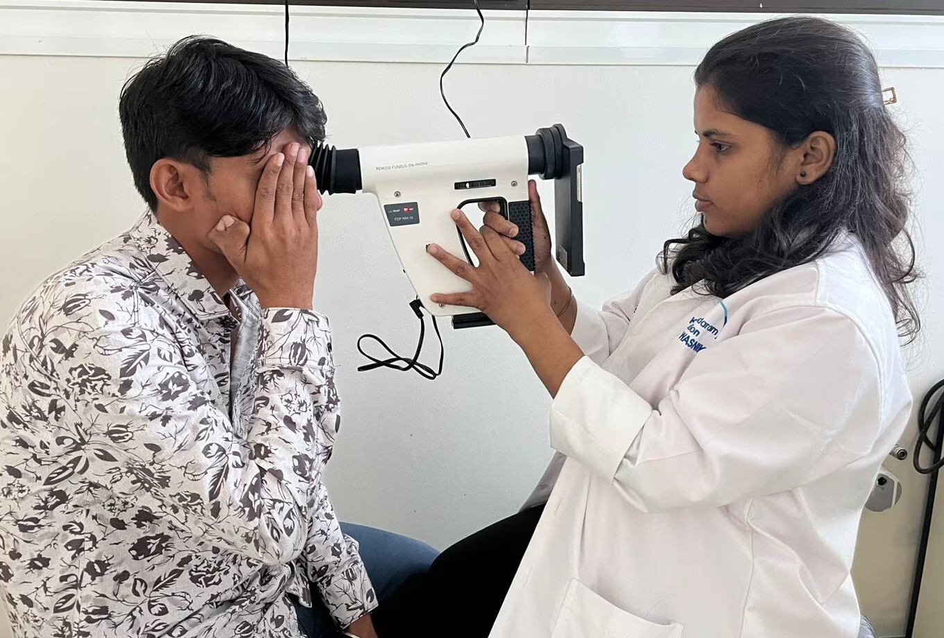 Dr. Avik examining a patient at Dharavi Center